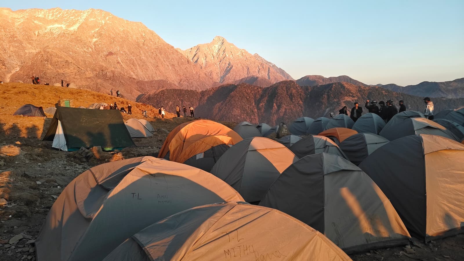 Tents at a mountain campsite at sunrise